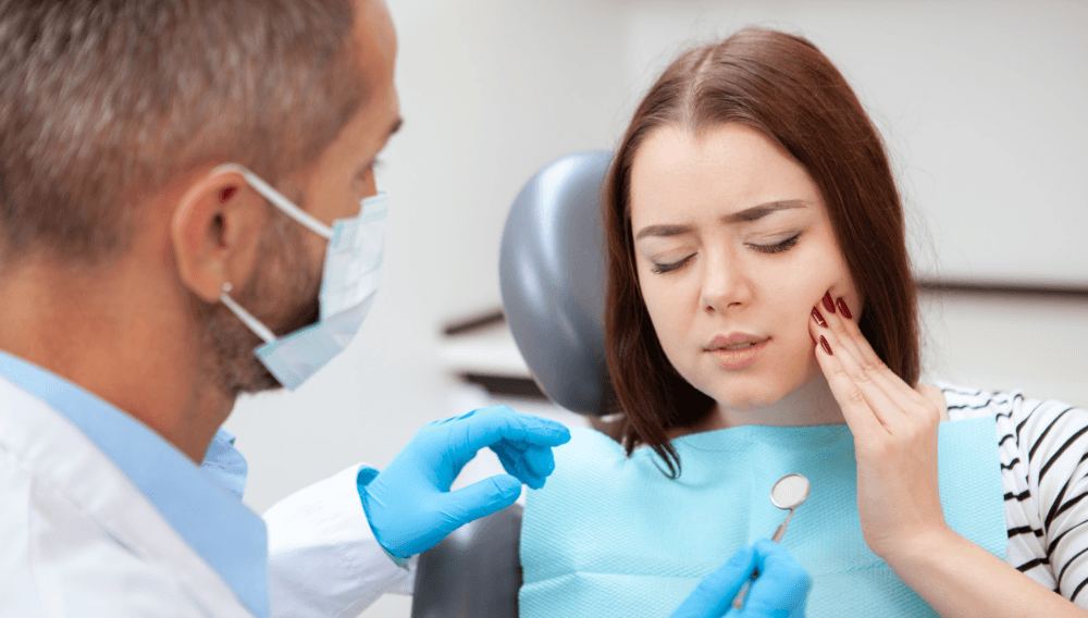 Emergency dentist in Thousand Oaks examining a patient with tooth pain at Smiles4Life.